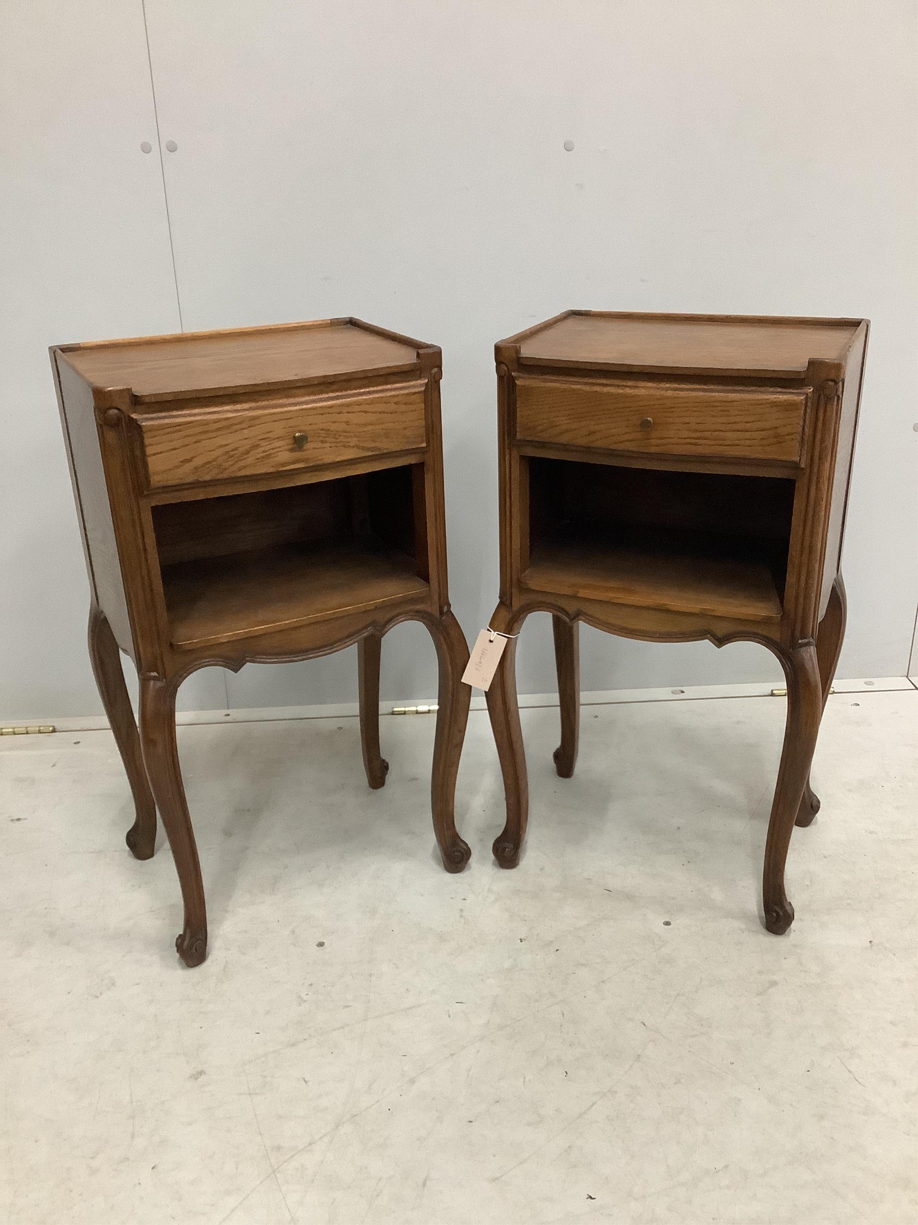 A pair of French oak bedside cabinets, width 38cm, depth 28cm, height 70cm. Condition - fair to good